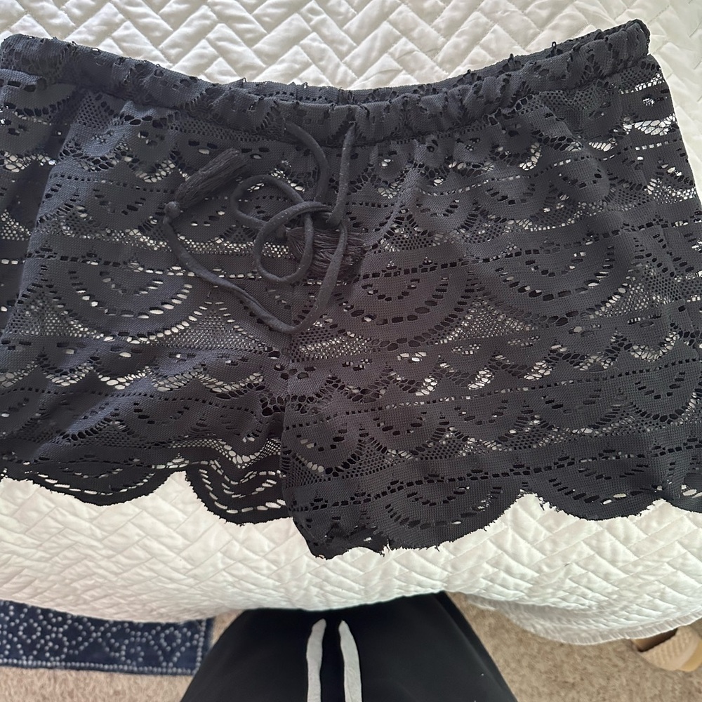 Black lace shorts. Great swim cover-up.Size xl juniors waist measures 16 inches.